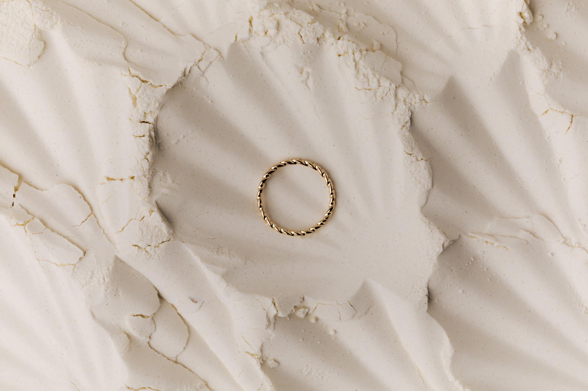 kaboompics jewellery display golden ring on flour canvas 37534
